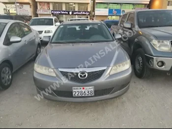 Mazda  Mazda 6  2005  Sedan  Automatic  4  150,000  FWD  Gray  Gasoline