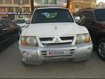 Mitsubishi  Pajero  GLS  2001  SUV  Automatic  6  22,000  4WD  White and Silver  Gasoline
