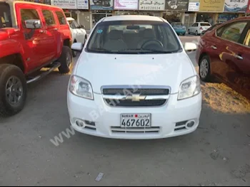 Chevrolet  Aveo  LS  2014  Sedan  Automatic  4  40,000  FWD  White  Gasoline