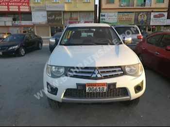 Mitsubishi  Pickup  2012  Pick Up  Automatic  4  80,000  RWD  White  Gasoline