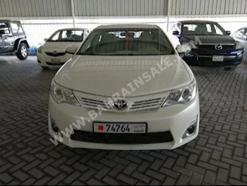 Toyota  Camry  GL  2015  Sedan  Automatic  4  100,000  FWD  Pearl  Gasoline