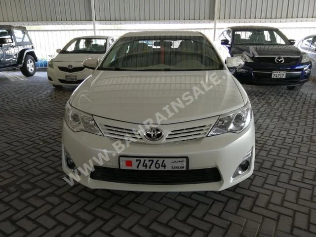 Toyota  Camry  GL  2015  Sedan  Automatic  4  100,000  FWD  Pearl  Gasoline