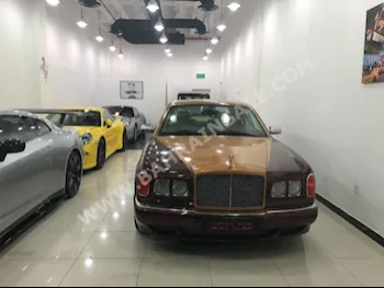 Bentley  Arnage  2004  Sedan  Automatic  12  91,000  RWD  Maroon  Gasoline