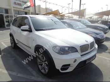 BMW  X-Series  5  2011  SUV  Automatic  8  211,000  4WD  White  Gasoline