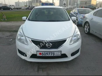 Nissan  Tiida  2014  Hatchback  Automatic  4  100,000  FWD  Pearl  Gasoline