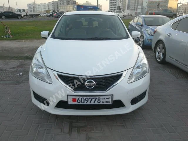 Nissan  Tiida  2014  Hatchback  Automatic  4  100,000  FWD  Pearl  Gasoline
