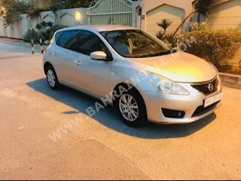 Nissan  Tiida  2014  Hatchback  Automatic  4  60,000  AWD  Silver  Gasoline