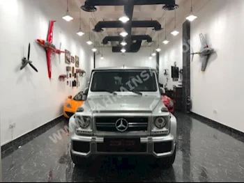 Mercedes-Benz  G-Class  63 AMG  2013  SUV  Automatic  8  98,000  4WD  Silver  Gasoline
