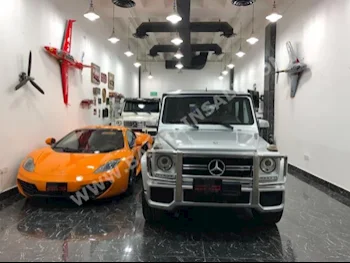 Mercedes-Benz  G-Class  55 AMG  2014  SUV  Automatic  8  63,000  4WD  Silver  Gasoline