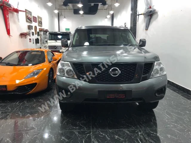 Nissan  Patrol  SE  2015  SUV  Manual  8  70,000  4WD  Silver  Gasoline