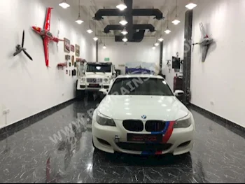 BMW  M-Series  5  2006  Sedan  Automatic  4  195,000  RWD  White  Gasoline