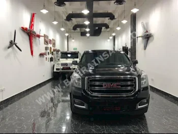 GMC  Yukon  SLE  2015  SUV  Automatic  8  88,000  4WD  Black  Gasoline