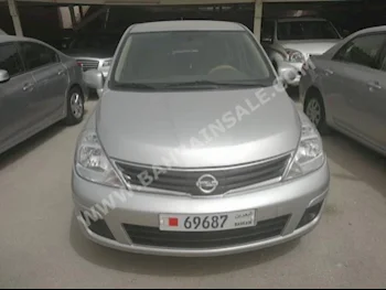 Nissan  Tiida  2013  Hatchback  Automatic  4  70,000  FWD  Silver  Gasoline