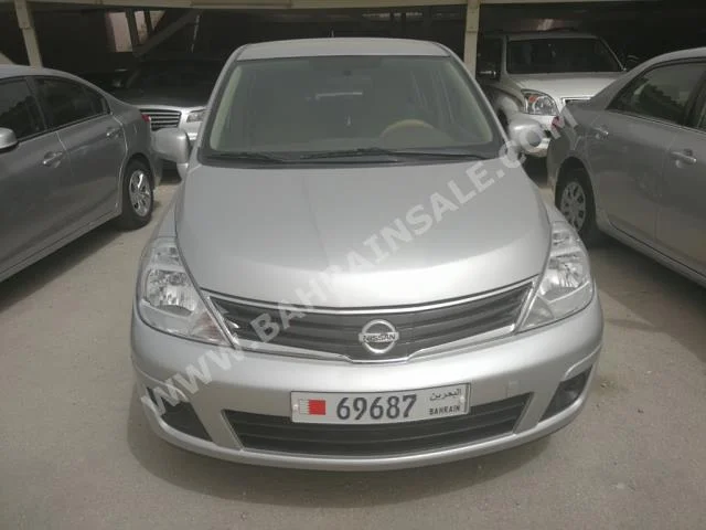 Nissan  Tiida  2013  Hatchback  Automatic  4  70,000  FWD  Silver  Gasoline