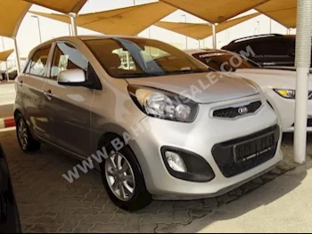 Kia  Picanto  2015  Hatchback  Automatic  4  91,000  FWD  Silver  Gasoline