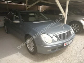 Mercedes-Benz  E-Class  240  2005  Sedan  Automatic  6  72,000  RWD  Gray  Gasoline