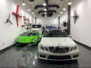Mercedes-Benz  E-Class  63 AMG  2010  Sedan  Automatic  6  34,000  RWD  White  Gasoline