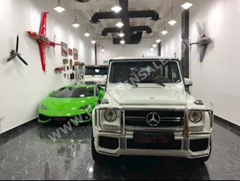 Mercedes-Benz  G-Class  55 AMG  2011  SUV  Automatic  8  63,000  4WD  White  Gasoline
