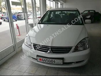 Mitsubishi  Lancer  2013  Sedan  Automatic  4  94,000  FWD  White  Gasoline