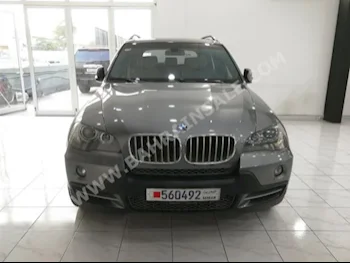 BMW  X-Series  5  2008  SUV  Automatic  8  900,000  RWD  Gray  Gasoline