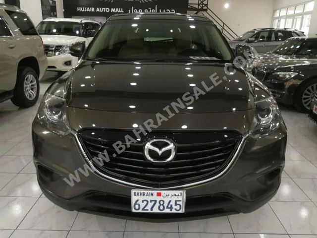 Mazda  CX  9  2015  SUV  Automatic  6  49,000  FWD  Gray  Gasoline