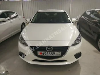 Mazda  Mazda 3  2015  Sedan  Automatic  4  52,000  FWD  White  Gasoline