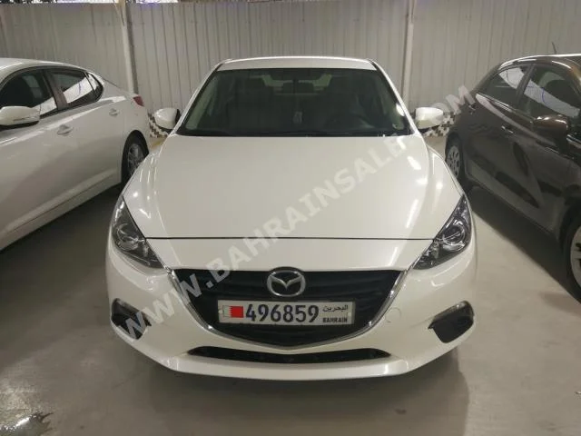 Mazda  Mazda 3  2015  Sedan  Automatic  4  52,000  FWD  White  Gasoline