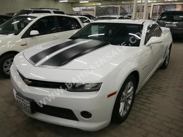 Chevrolet  Camaro  2014  Coupe / Sport  Automatic  6  42,000  RWD  White & Black  Gasoline