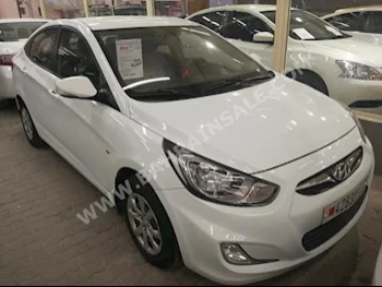 Hyundai  Accent  2013  Sedan  Automatic  4  105,000  FWD  White  Gasoline