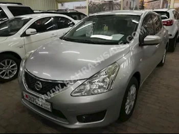 Nissan  Tiida  2011  Sedan  Automatic  4  64,000  FWD  Silver  Gasoline