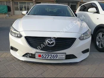Mazda  Mazda 6  2014  Sedan  Automatic  4  60,000  FWD  White  Gasoline