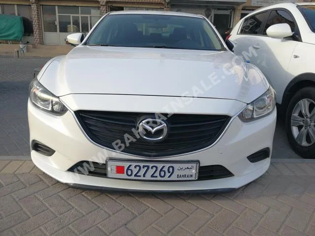 Mazda  Mazda 6  2014  Sedan  Automatic  4  60,000  FWD  White  Gasoline