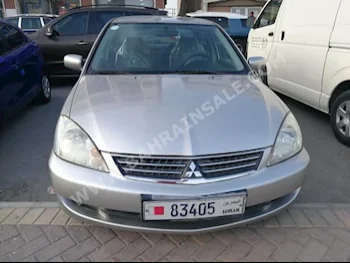 Mitsubishi  Lancer  2012  Sedan  Automatic  4  90,000  FWD  Silver  Gasoline