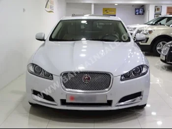 Jaguar  XF  V6 Supercharged  2015  Sedan  Tiptronic  6  26,000  FWD  White  Gasoline