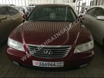 Hyundai  Azera  2009  Sedan  Automatic  4  152,000  FWD  Maroon  Gasoline
