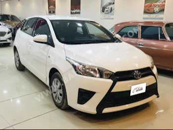 Toyota  Yaris  2015  Hatchback  Automatic  4  72,000  FWD  White  Gasoline