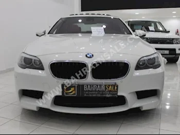 BMW  M-Series  5  2012  Sedan  SMG  8  48,000  RWD  White  Gasoline