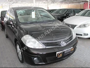 Nissan  Tiida  2012  Hatchback  Automatic  4  100,000  FWD  Black  Gasoline