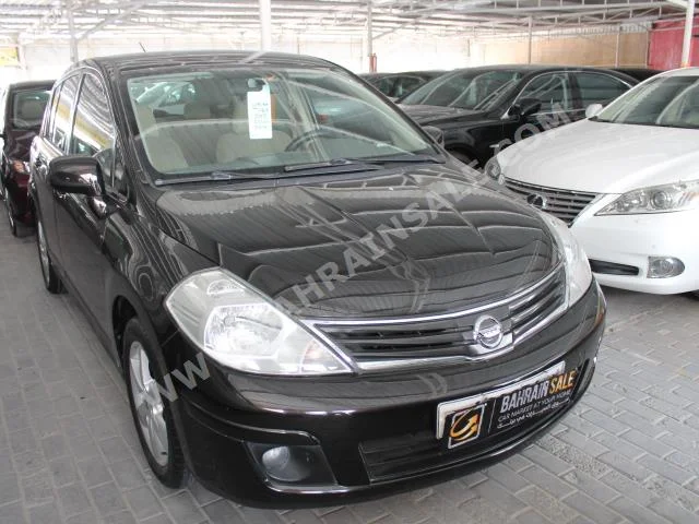 Nissan  Tiida  2012  Hatchback  Automatic  4  100,000  FWD  Black  Gasoline