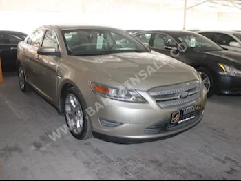 Ford  Taurus  2011  Sedan  Automatic  6  70,000  FWD  Gold  Gasoline