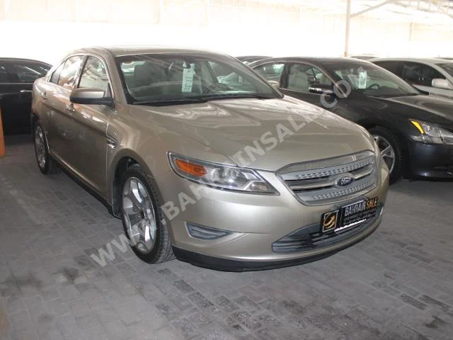 Ford  Taurus  2011  Sedan  Automatic  6  70,000  FWD  Gold  Gasoline