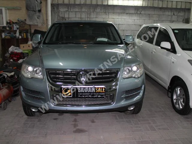 Volkswagen  Touareg  2008  SUV  Automatic  6  98,000  4WD  Sky Blue  Gasoline