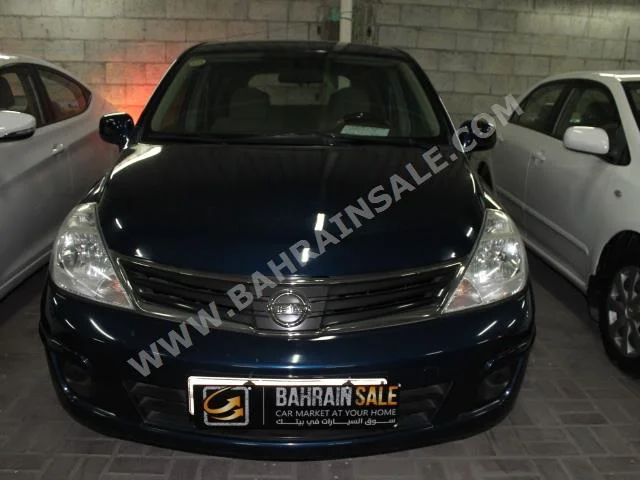 Nissan  Tiida  2013  Hatchback  Automatic  4  84,000  FWD  Dark Blue  Gasoline