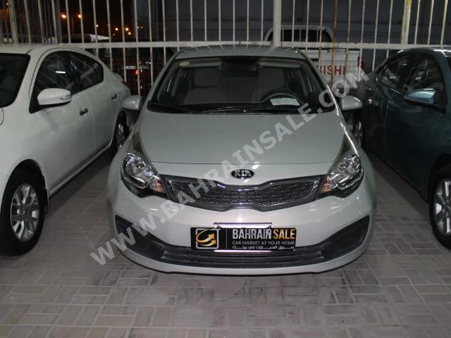 Kia  Rio  2014  Sedan  Automatic  4  93,000  FWD  Silver  Gasoline