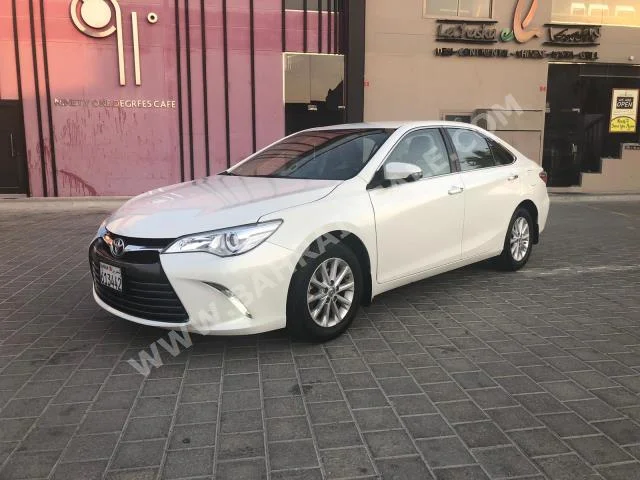 Toyota  Camry  GL  2017  Sedan  Automatic  4  117,000  FWD  White  Gasoline