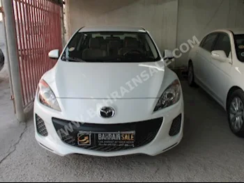 Mazda  Mazda 3  2013  Sedan  Automatic  4  68,000  FWD  White  Gasoline