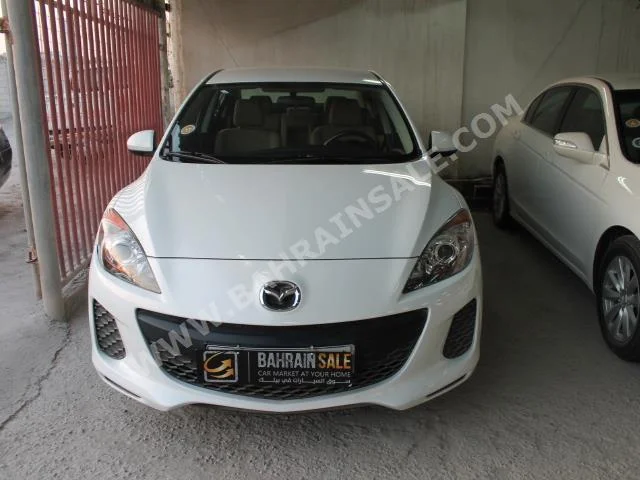 Mazda  Mazda 3  2013  Sedan  Automatic  4  68,000  FWD  White  Gasoline