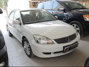 Mitsubishi  Lancer  2013  Sedan  Automatic  4  100,000  FWD  White  Gasoline