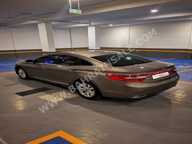 Hyundai  Azera  2013  Sedan  Automatic  6  170,000  FWD  Gold  Gasoline