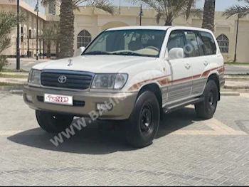 تويوتا لاند كروزر جي اكس ار 2003 فان \ باص اتوماتك 6 270,000 دفع رباعي أبيض بنزين